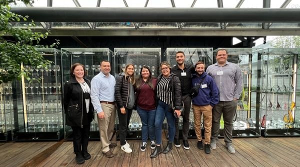 AU sports management and MBA students working NFL Experience event in  Arizona